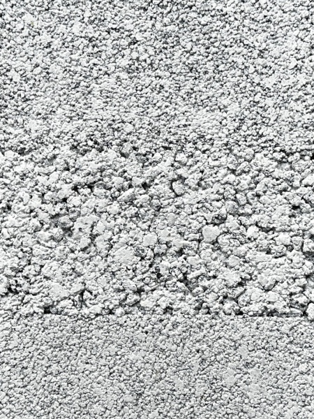 溶岩石を使った白いプラスタル塗り版築壁サンプル。型番：HSP0072